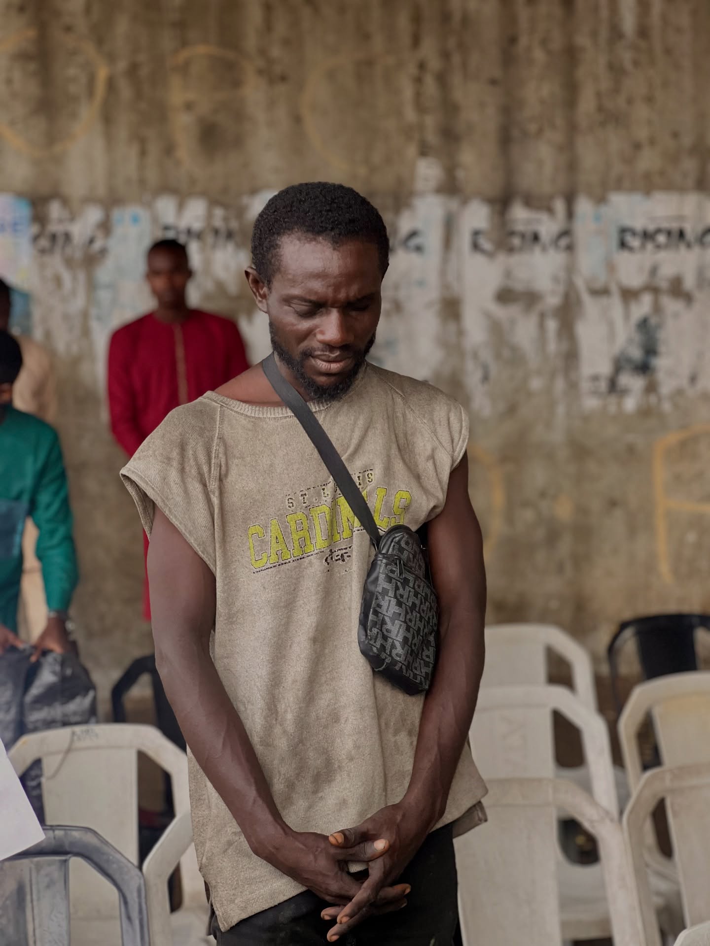 Man in prayer at outreach