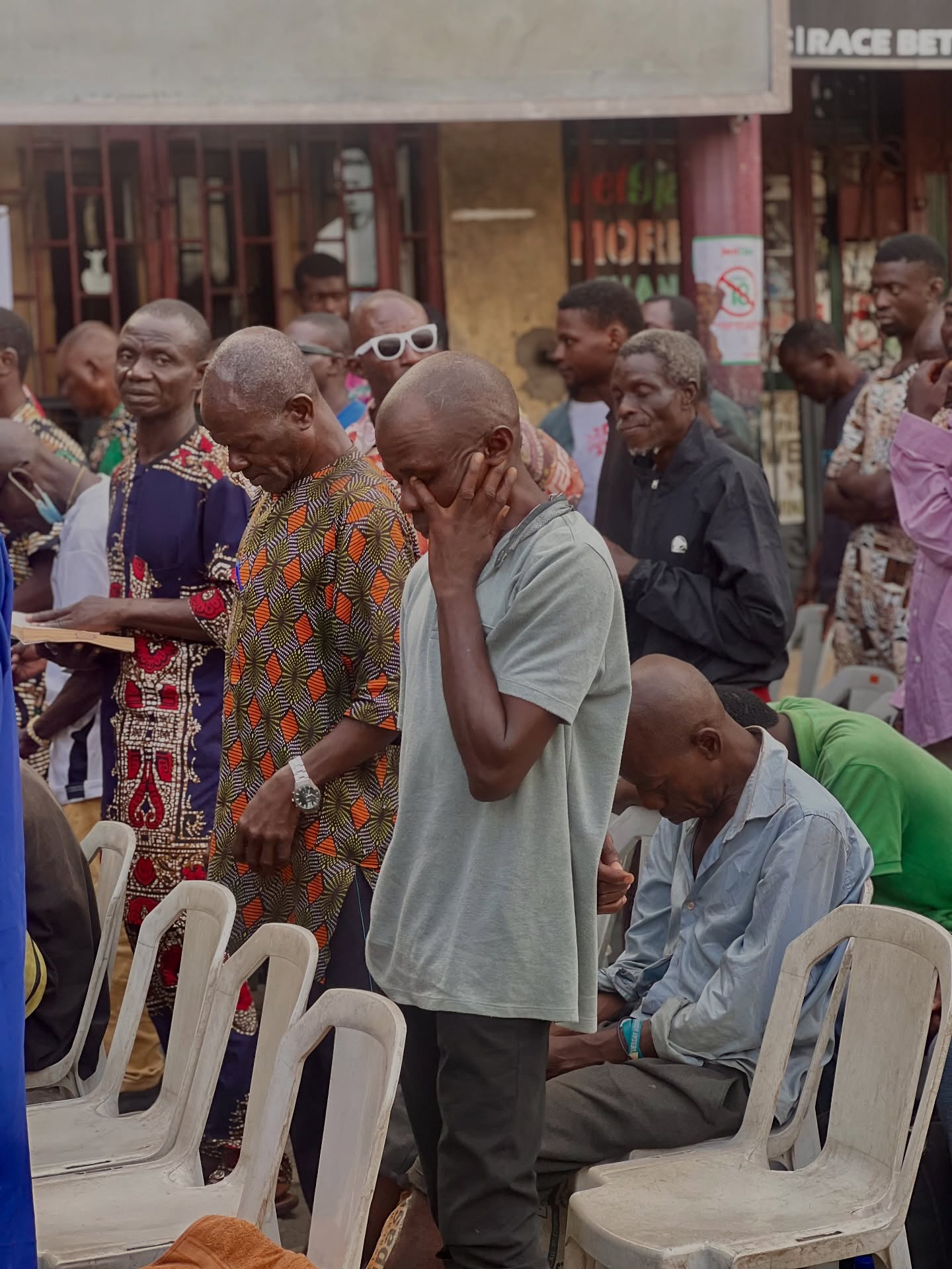 Street prayer with beneficiaries