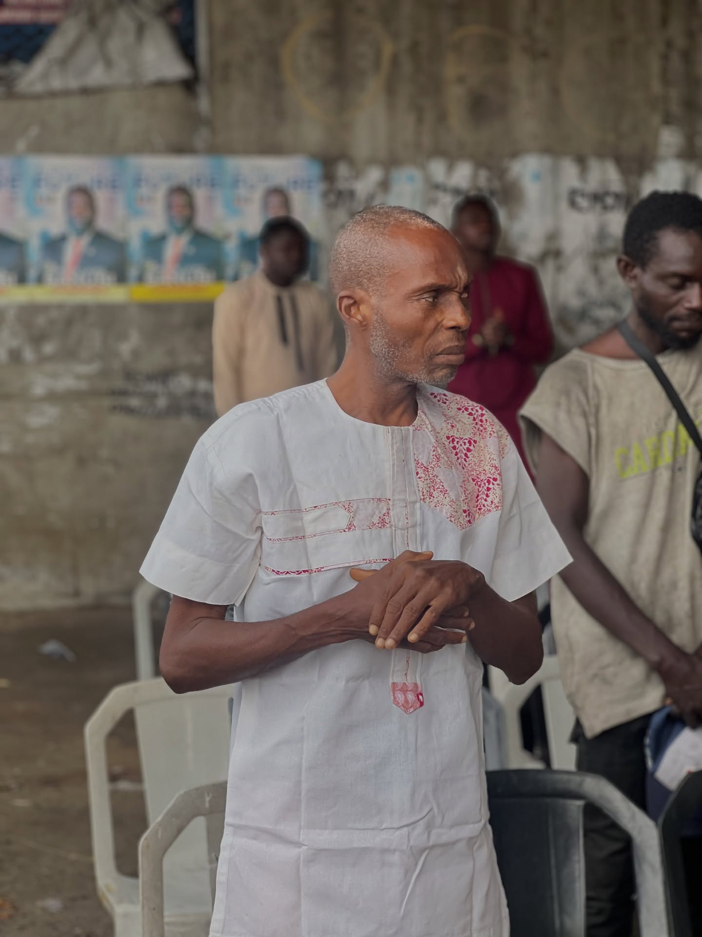 Man in prayer during outreach